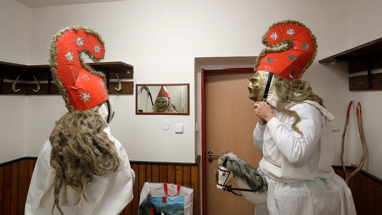 Revelers prepare for a traditional St Nicholas procession in the village of Valasska Polanka, Czech Republic, Saturday, Dec. 7, 2019