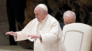 Pope Francis arrives for an audience with Vatican's employees in the Paul VI Hall, at the Vatican, 22 December 2022