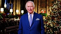 Britain's King Charles III delivers his message during the recording of his first Christmas broadcast in the Quire of St George's Chapel at Windsor Castle, 13 December 2022