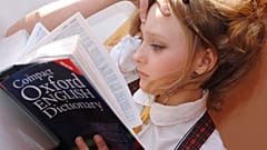 Girl reading dictionary