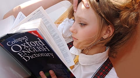Girl reading dictionary