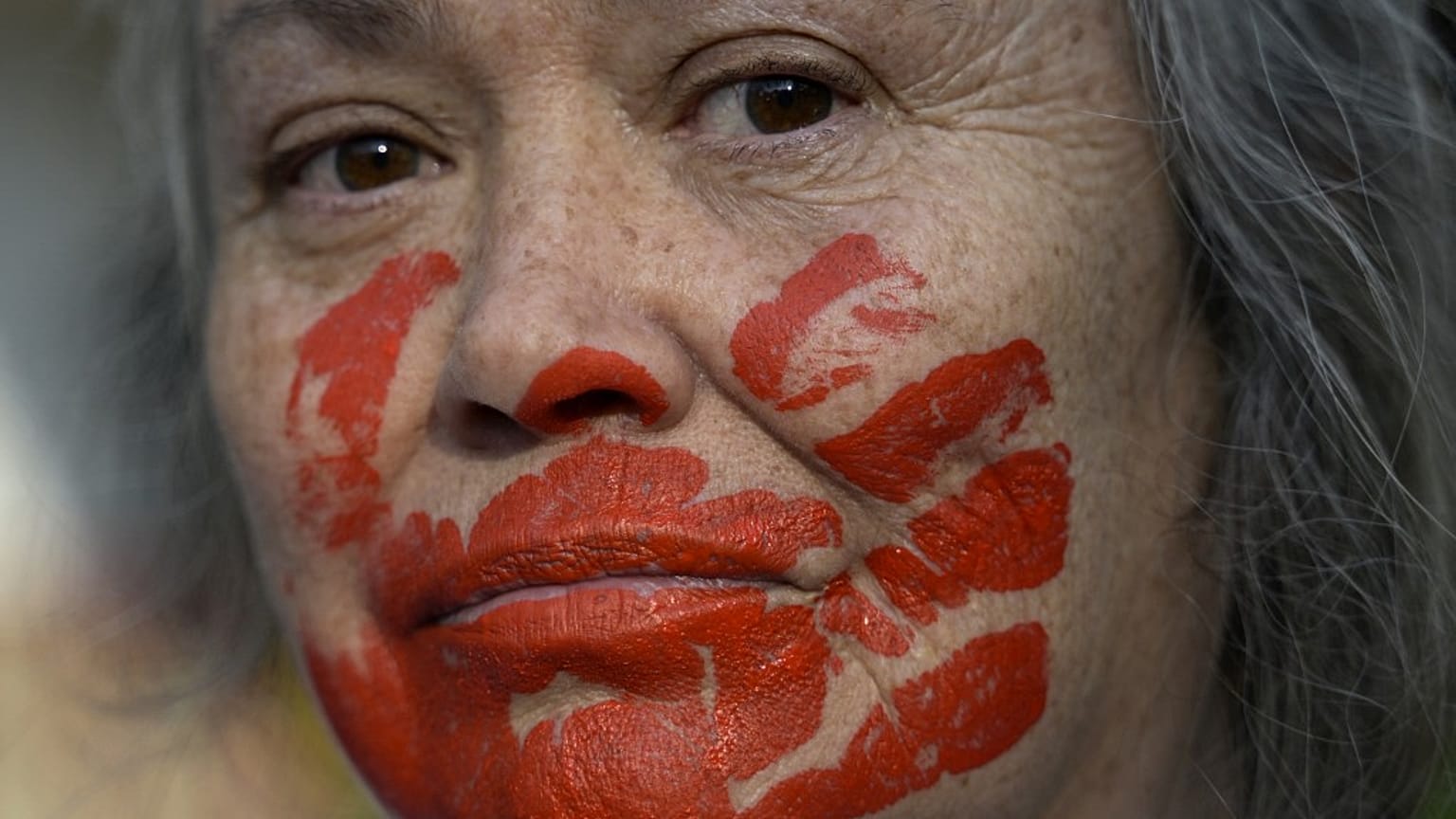 A woman takes part in a protest against the execution of Iranian footballer Amir Nasr-Azadani in front of the Iranian embassy in Mexico City on December 19, 2022.