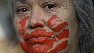 A woman takes part in a protest against the execution of Iranian footballer Amir Nasr-Azadani in front of the Iranian embassy in Mexico City on December 19, 2022.