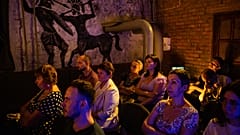 Spectators watch a performance at the underground of the Mykolaiv Drama Theatre for the first time since the start of the war.