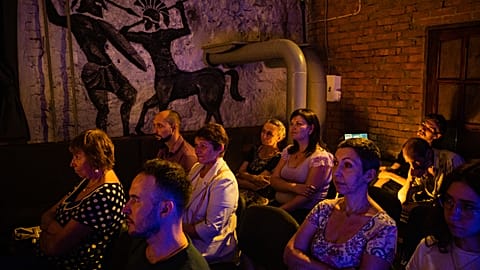 Spectators watch a performance at the underground of the Mykolaiv Drama Theatre for the first time since the start of the war.