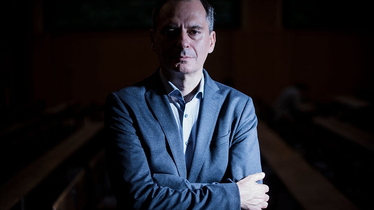 Bulgarian investigative journalist and lead Russia investigator with Bellingcat Christo Grozev poses for a photo session at the Institute of Political Studies