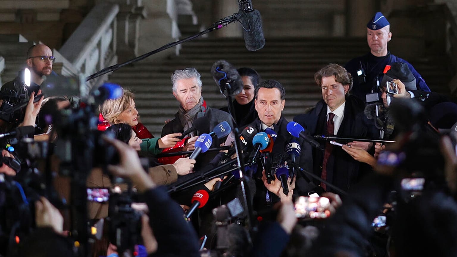 Lawyers for former European Parliament Vice-President Eva Kaili, Michalis Dimitrakopoulos, center right, and Andre Risopoulos, center left, speak with the media, 22 Dec 2022. 