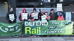 Members of the RMT union on a picket line outside Euston Station in London