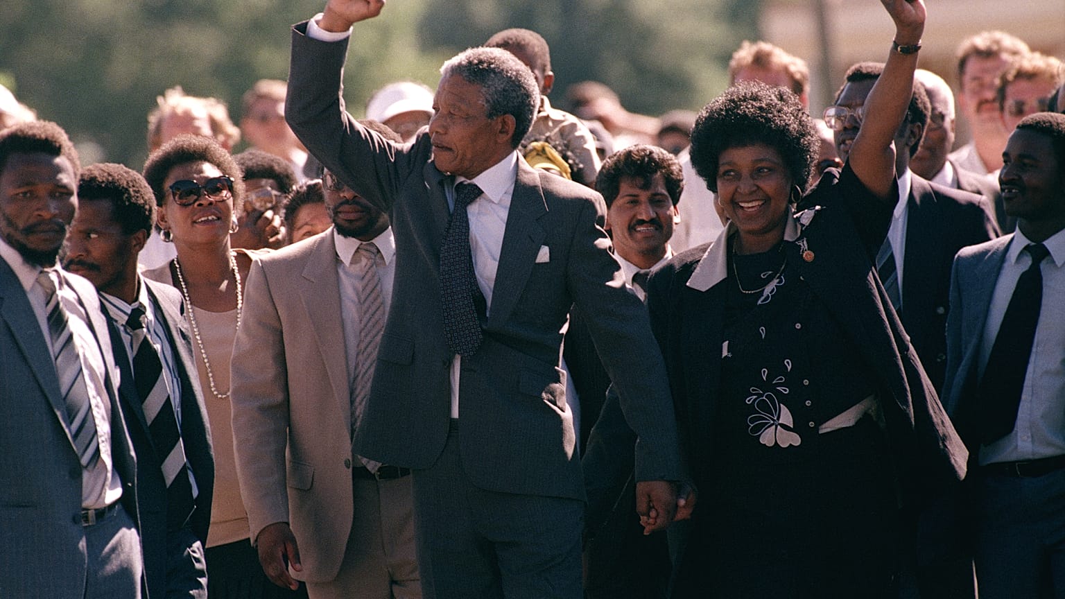 Nelson Mandela and wife Winnie, walking hand in hand, raise clenched fists upon his release from Victor prison, Cape Town, Sunday, February 11, 1990