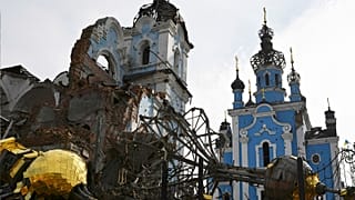 Destroyed domes lie next to a damaged church in the retaken village of Bohorodychne, eastern Ukraine, 22 October 2022