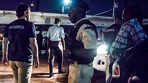 Interpol officers during a raid in night clubs in Georgetown, Guyana, on April 7, 2018.