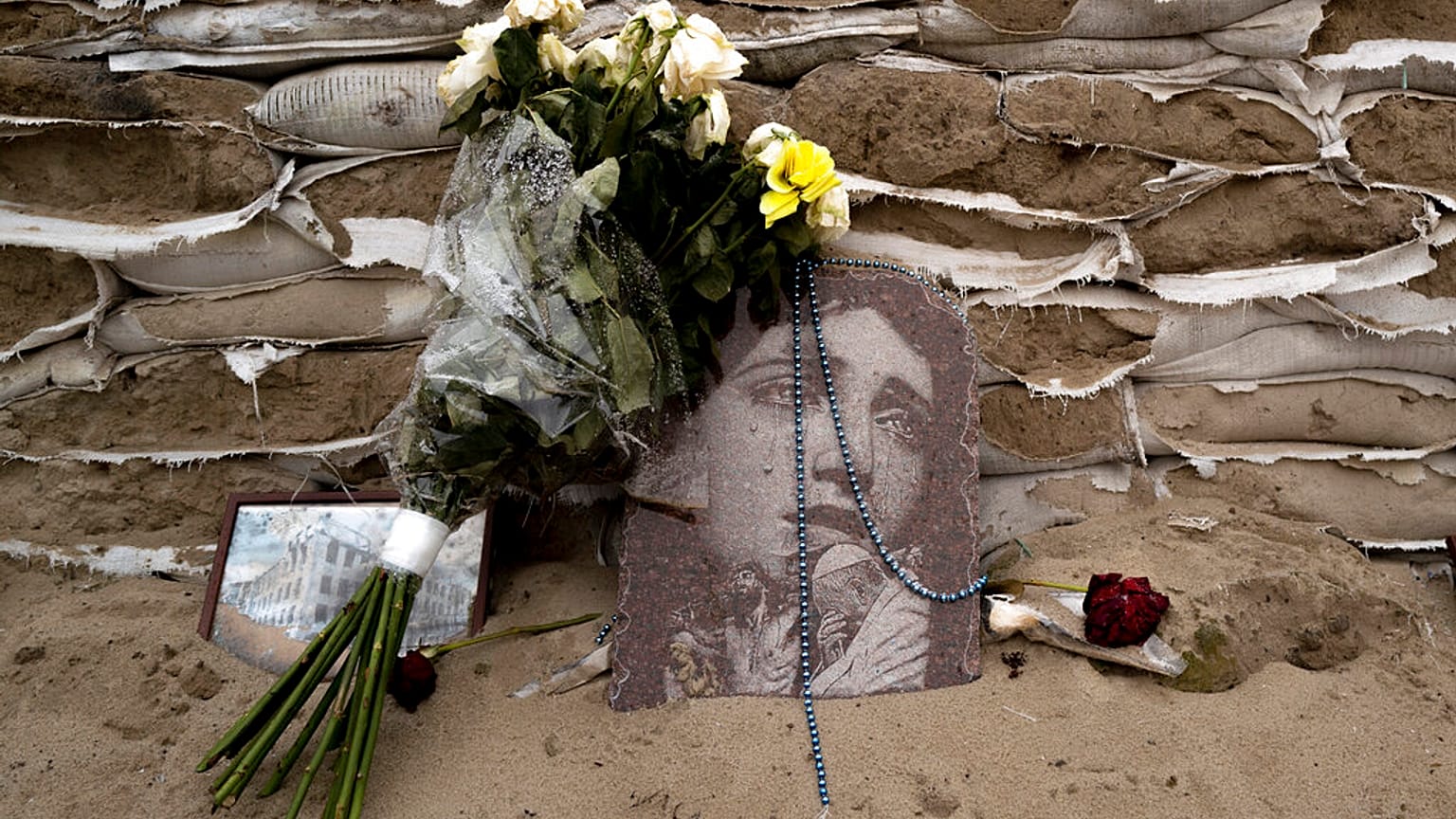 FILE: A religious picture lies on sandbags covering the historical monument of Princess Olga in Kyiv, 6 January 2023