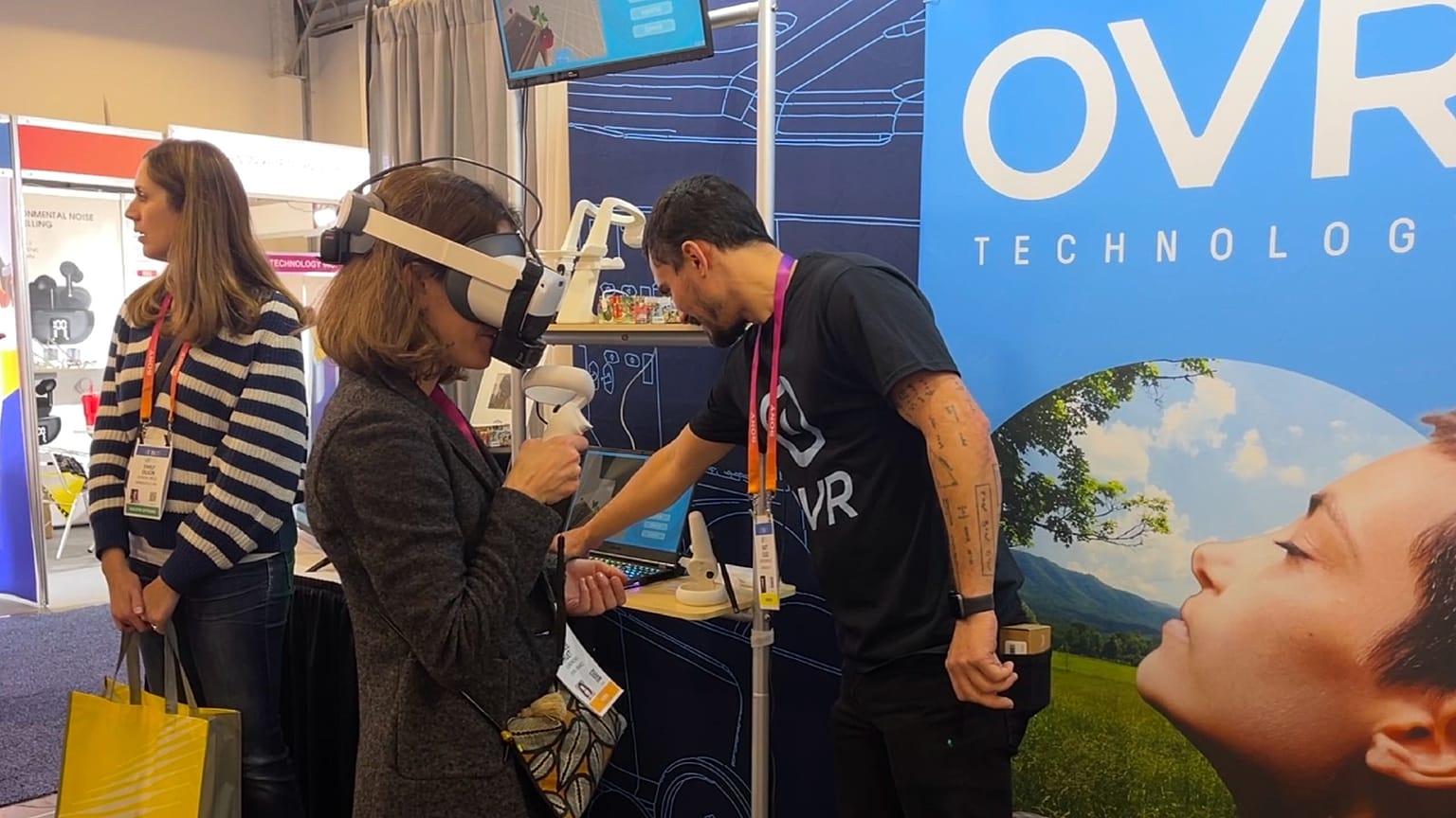 Stopping to smell virtual roses using OVR's wearable scent technology at CES in Las Vegas, USA, January 5, 2022.