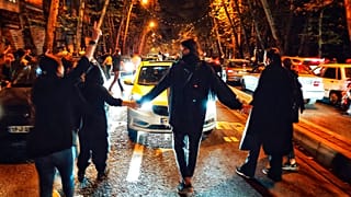 Women protest the death of 22-year-old woman Mahsa Amini who was detained by the morality police, in Tehran, Saturday, Oct. 1, 2022.