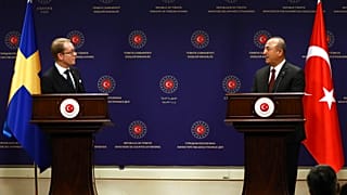 Turkey's Foreign Minister Mevlut Cavusoglu, right, and Sweden's Foreign Minister Tobias Billstrom hold a press conference in Ankara, Turkey, Thursday, Dec. 22, 2022.