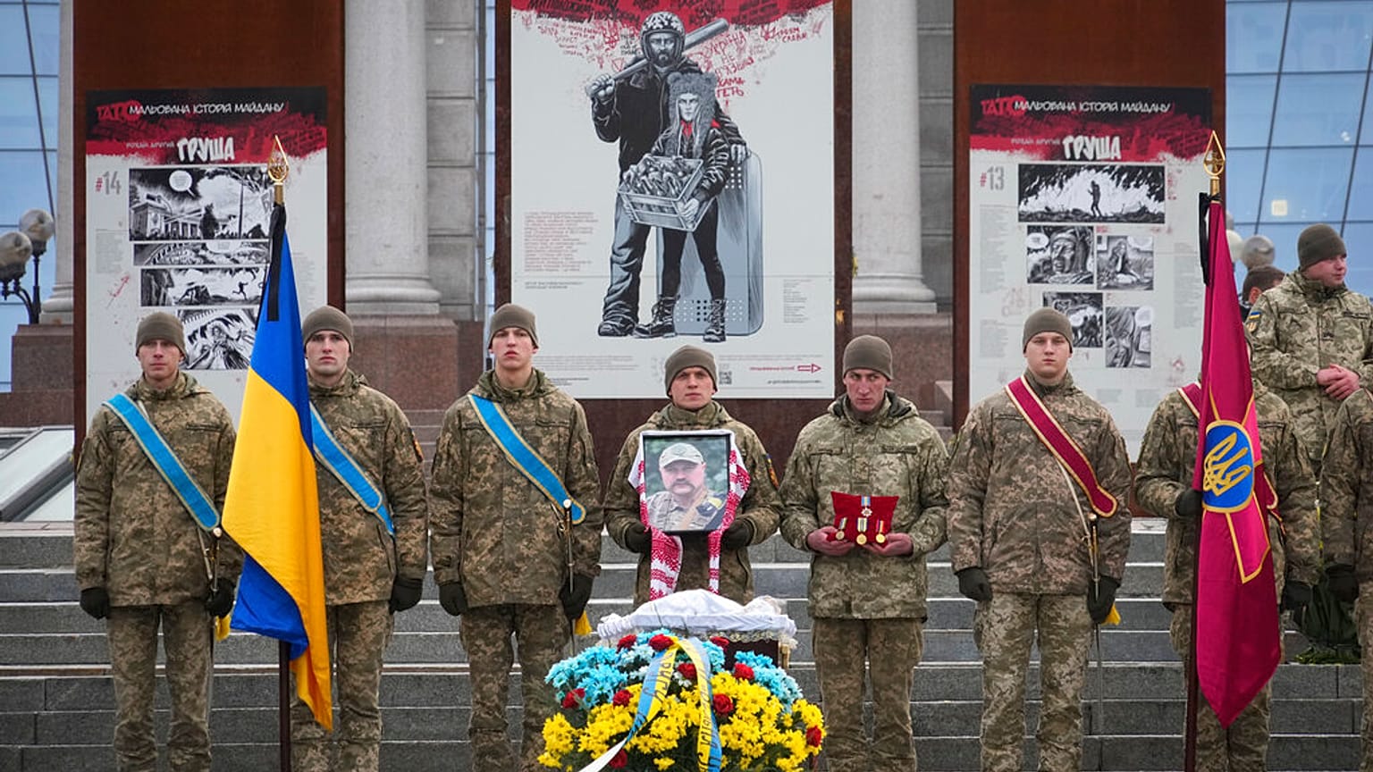 Ukrainian servicemen pay their last respect at the coffin of their comrade Oleh Yurchenko killed in a battlefield with Russian forces in the Donetsk, during a ceremony, 8 Jan.