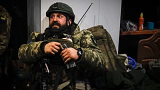 A Ukrainian officer sits in a shelter in Soledar, the site of heavy battles with Russian forces in the Donetsk region, Ukraine. Sunday, 8 January 2023.