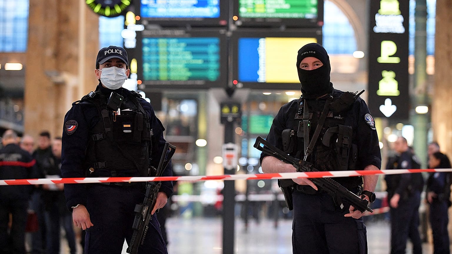 French police stand guard in a cordonned off area at Paris' Gare du Nord train station, 11 January 2023