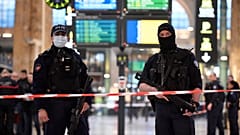 French police stand guard in a cordonned off area at Paris' Gare du Nord train station, 11 January 2023