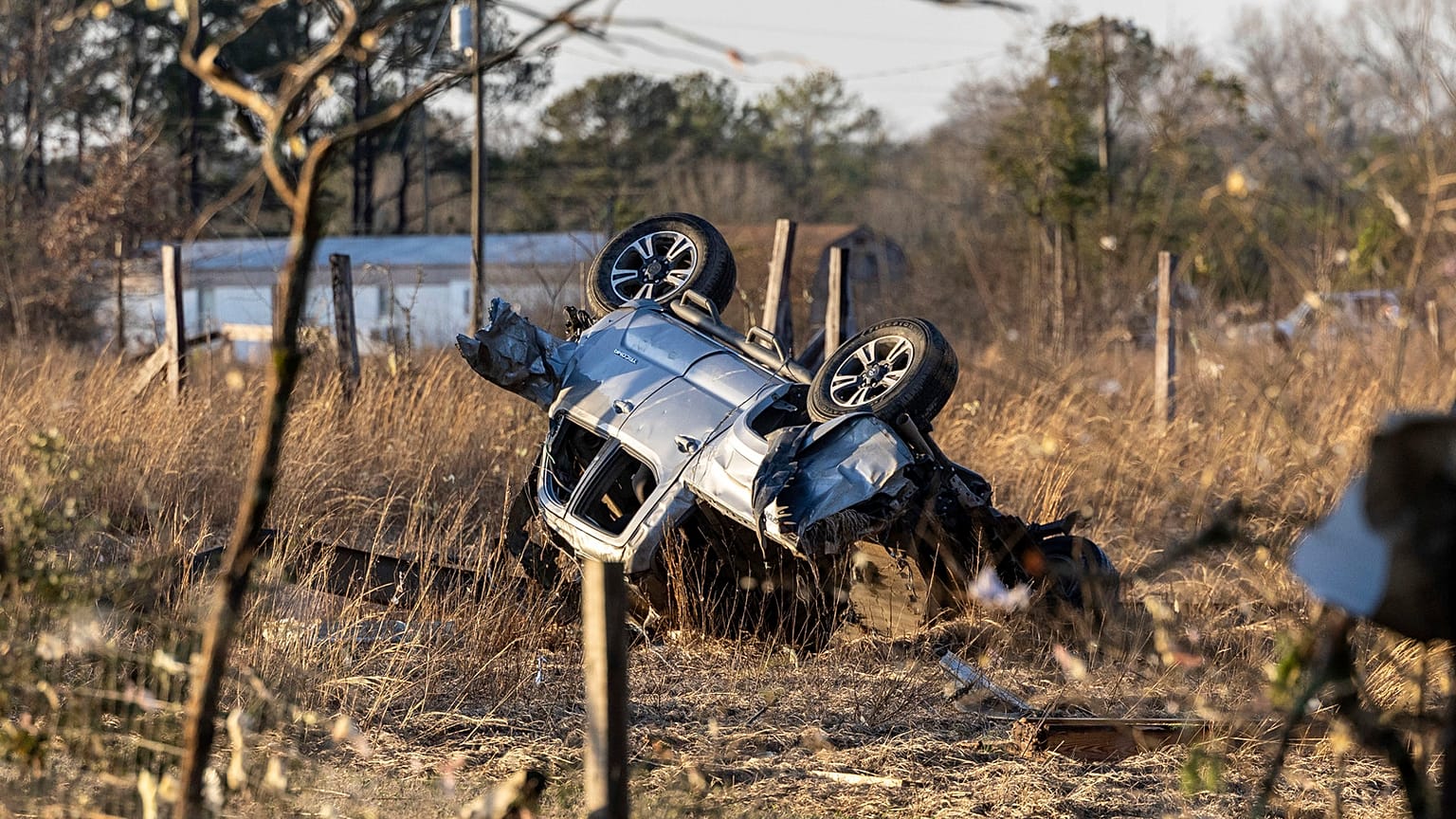 An SUV is overturned near 1349 County Road 43 in the aftermath from severe weather. Thursday, 12 January 2023, in Prattville, Alabama.