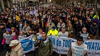 People gather during a protest in support of public health care in Madrid, Spain. Sunday, 15 January 2023.