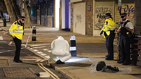 A 22-year-old man has been arrested on suspicion of attempted murder after a drive-by shooting outside a church by Euston station, in London