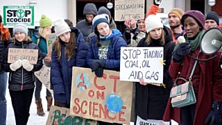 Activist Vanessa Nakate, right, speaks beside Luisa Neubauer, Greta Thunberg and Helena Gualinga among other activists at a climate protest outside the World Economic Forum.