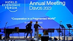 People set up the stage at the eve of the opening of the World Economic Forum in Davos, Switzerland, Sunday, January 15, 2023. 