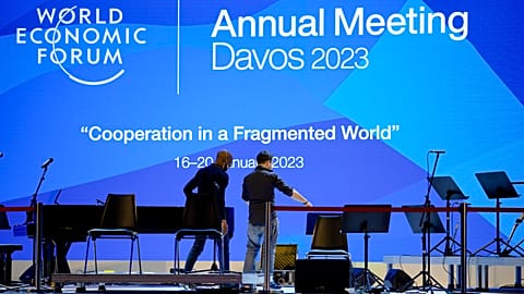 People set up the stage at the eve of the opening of the World Economic Forum in Davos, Switzerland, Sunday, January 15, 2023. 