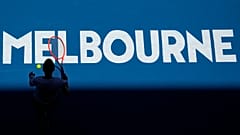 Katherine Sebov of Canada walks to serve to Caroline Garcia of France during their first round match at the Australian Open in Melbourne, 17 January 2023