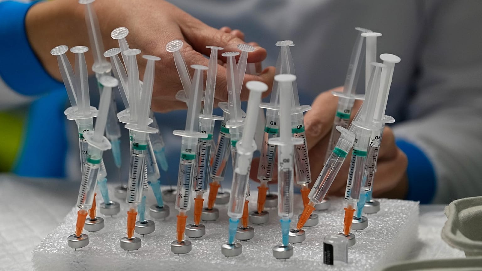 A nurse prepares vaccines in the Wizink Center, currently used for COVID-19 vaccinations in Madrid, Dec. 1, 2021. 