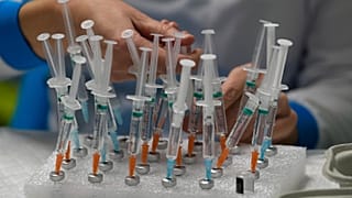 A nurse prepares vaccines in the Wizink Center, currently used for COVID-19 vaccinations in Madrid, Dec. 1, 2021. 