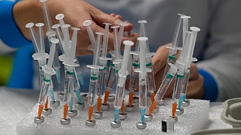 A nurse prepares vaccines in the Wizink Center, currently used for COVID-19 vaccinations in Madrid, Dec. 1, 2021. 