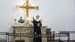 FILE: Evangelical Lutheran Church of Denmark priest conducting a service