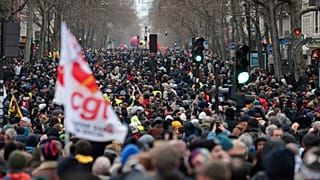 Protestors march during a demonstration against pension changes.