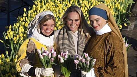 Three-time Olympic gold medallist Irene Schouten, centre, posed with women dressed in costumes inspired by Dutch Golden Age painter Johannes Vermeer's paintings
