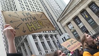 Protesters defending abortion rights chanted and held signs as they gathered in Wall Street, New York.