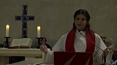 Sally Azar, a Palestinian pastor, speaks from the pulpit inside the Lutheran church in Jerusalem's Old City, January, 22, 2023