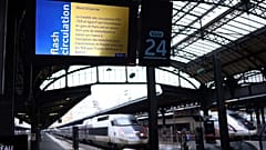 A photo shows a screen displaying a traffic alert message at a platform entrance during a total traffic shutdown at the Gare de l'Est train station in Paris on January 24, 202