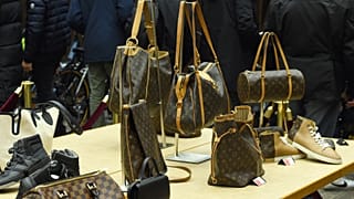 Louis Vuitton shoes and bags are presented at the Economy Ministry in Paris, where Agrasc sells goods from seizures and judicial confiscations 