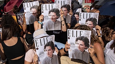 Fans congregate in front of the red carpet ahead of the film premiere of "Bones and All," which stars Timothee Chalamet