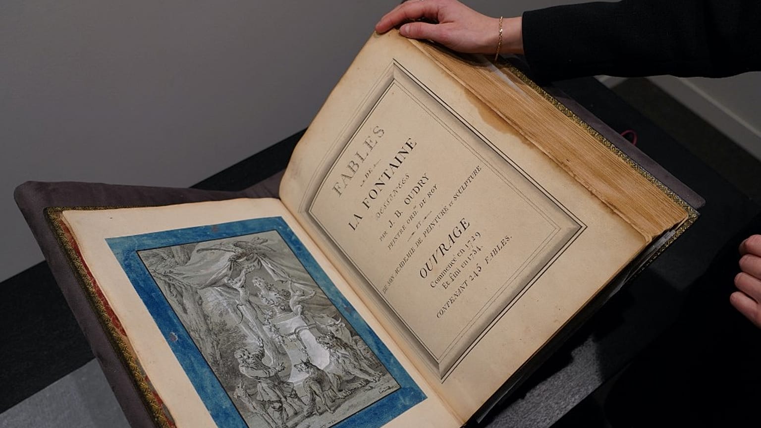An album of drawings by French artist Jean-Baptiste Oudry for the Fables de Jean de La Fontaine is displayed at Christie's in New York in January 2023
