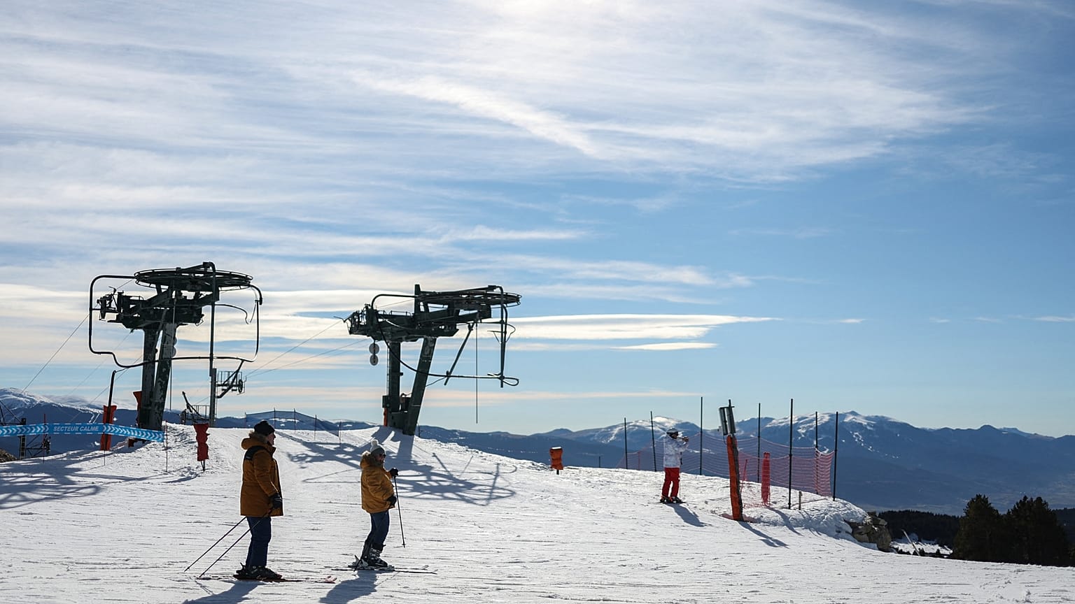 Skiers prepare to ride a slope at the Font-Romeu/Bolquere Pyrenees 2000 ski resort.