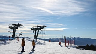 Skiers prepare to ride a slope at the Font-Romeu/Bolquere Pyrenees 2000 ski resort.