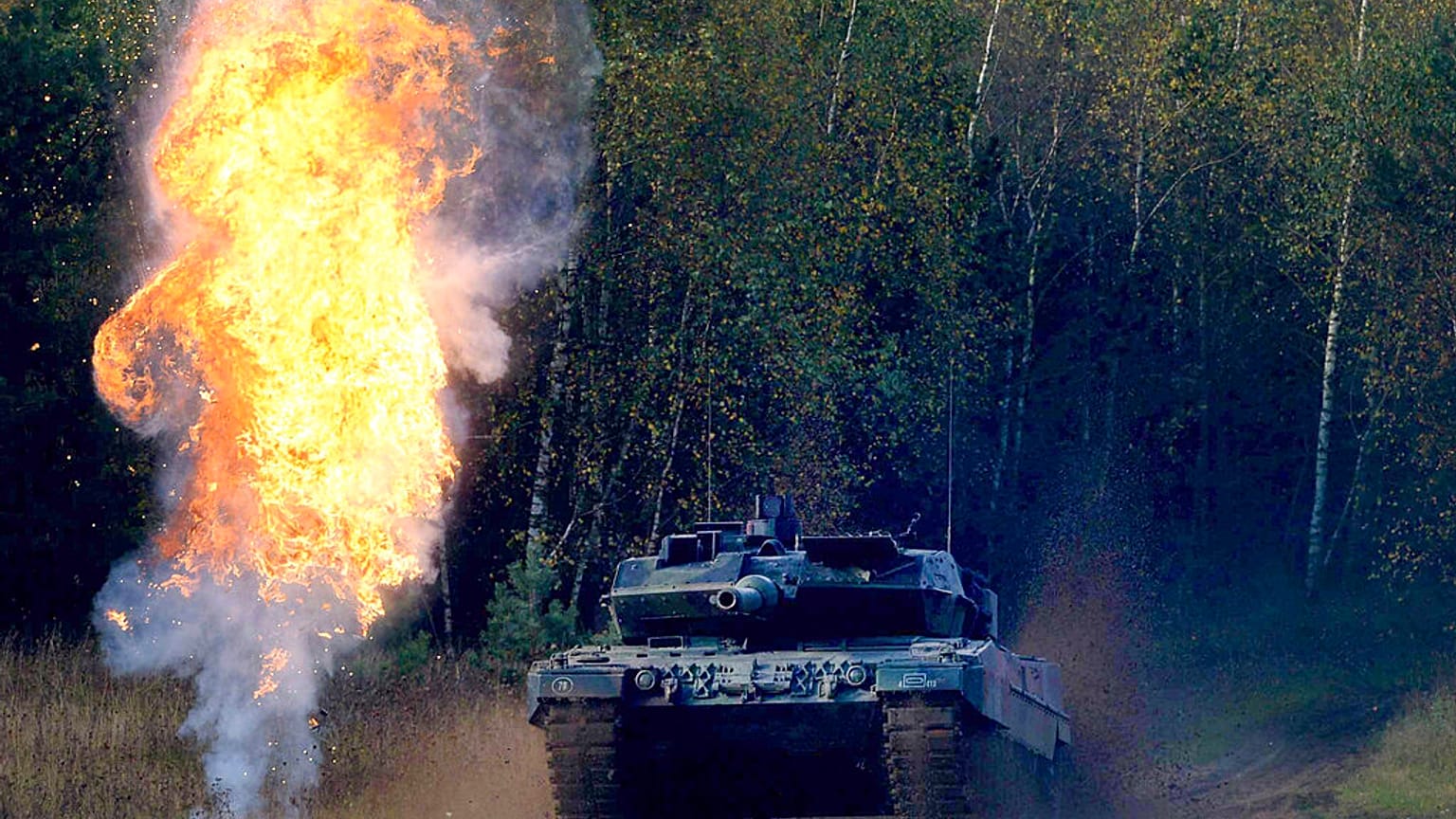 A Leopard tank drives through the terrain during the 'Land Operations' information training exercise in Germany in 2014
