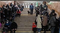 People gather in a subway station being used as a bomb shelter during a Russian rocket attack in Kyiv