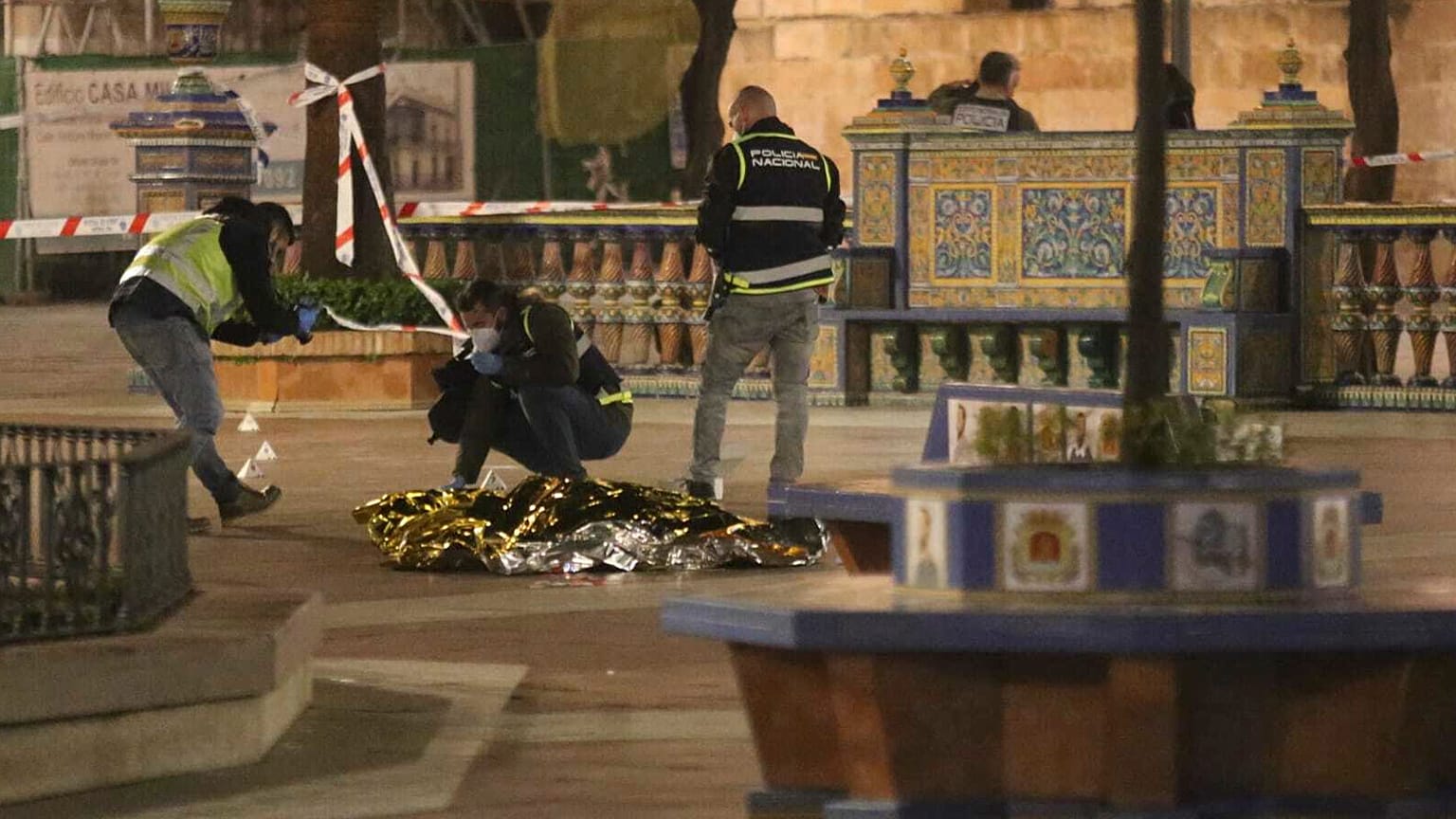 Police work next to the body of a man killed in Algeciras, southern Spain, Wednesday, 25 Jan. 2023. 