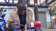 Kenyan teacher Paul Waweru has found a novel use for old laptop batteries.