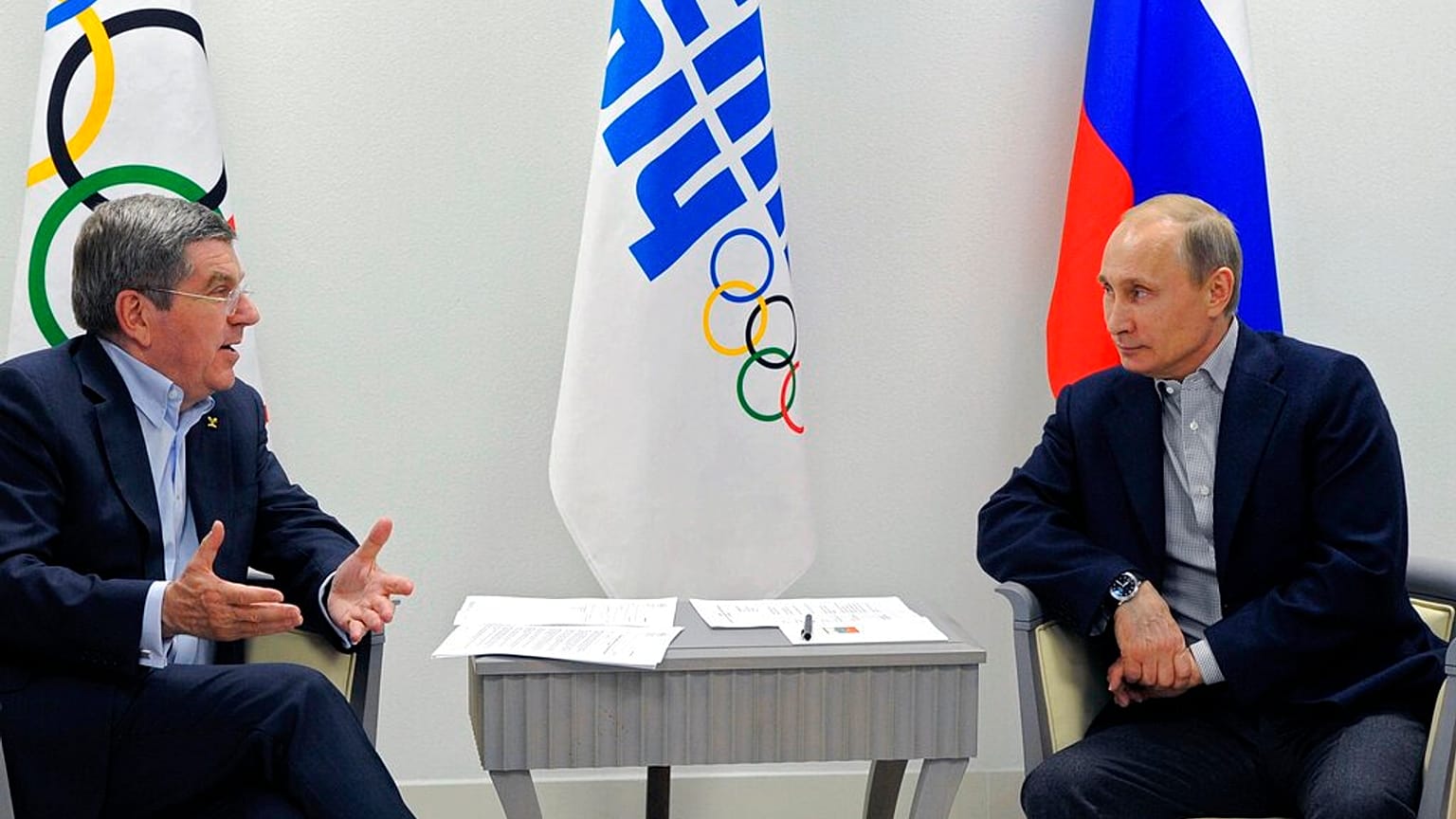 FILE - In this Feb. 15, 2014 photo Russian President Vladimir Putin, right, and IOC President Thomas Bach meet in the Bolshoi Ice Dome in Sochi, Russia.