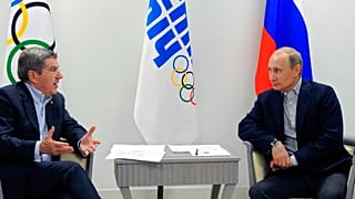 FILE - In this Feb. 15, 2014 photo Russian President Vladimir Putin, right, and IOC President Thomas Bach meet in the Bolshoi Ice Dome in Sochi, Russia.